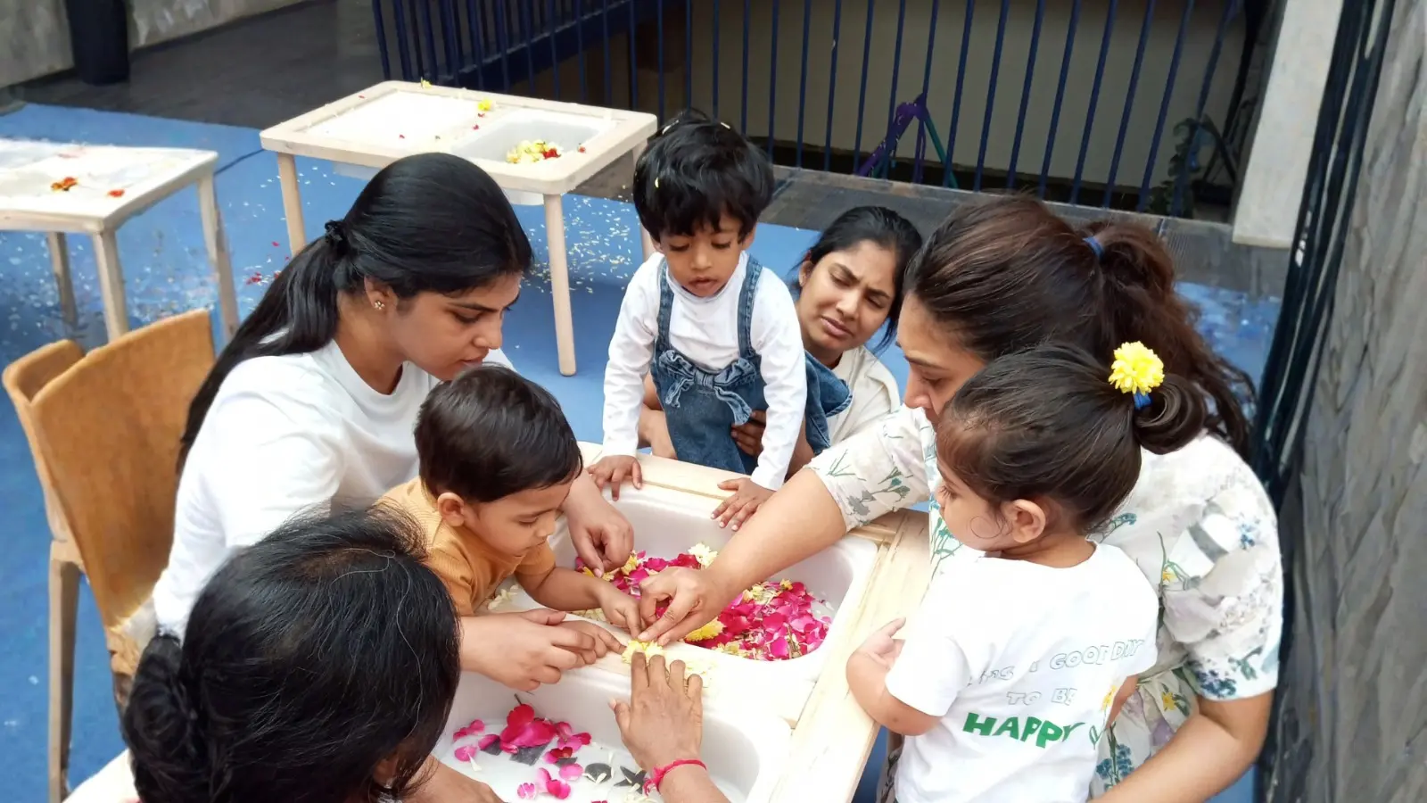Educator assisting a child in a preschool